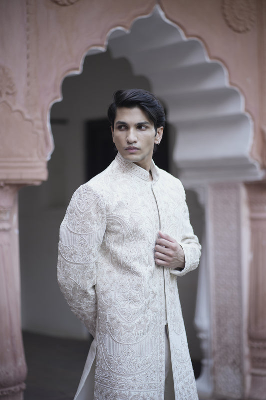 Luxury Rose Gold Sherwani Adorned with Resham, Pearl, and Thread Work, Paired with Silk Ensemble